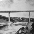 Návrh železobetonového mostu přes údolí Vltavy z roku 1935. Návrh vypracovali ing. Dr. R. Husák, ing. L. Horák a ing. Jos. Kratochvíl