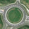 Ústí nad Labem – křížení 4pruhové silnice s 2pruhovou. Adaptace by zvýšila kapacitu OK v hlavním (4pruhovém) směru v obou směrech, a to bez průpletů.
